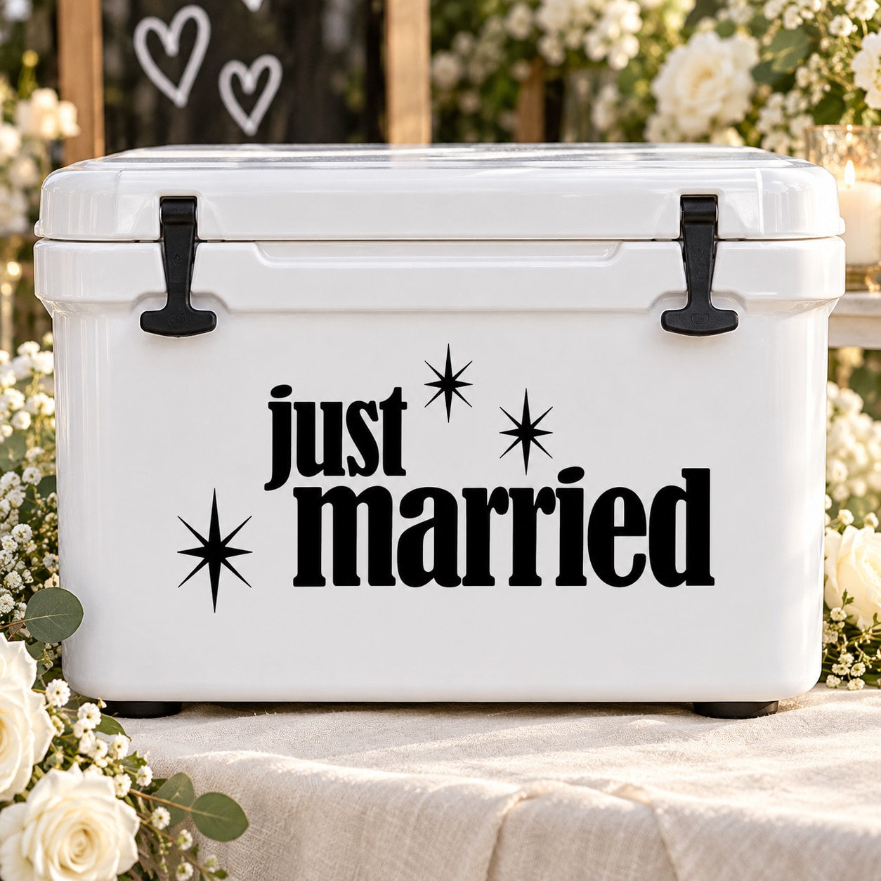 Just Married star decal on white surface, with black “just married” lettering and sparkle icons