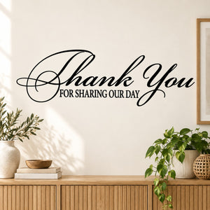Wall decal reading “Thank You for Sharing Our Day” in black cursive script