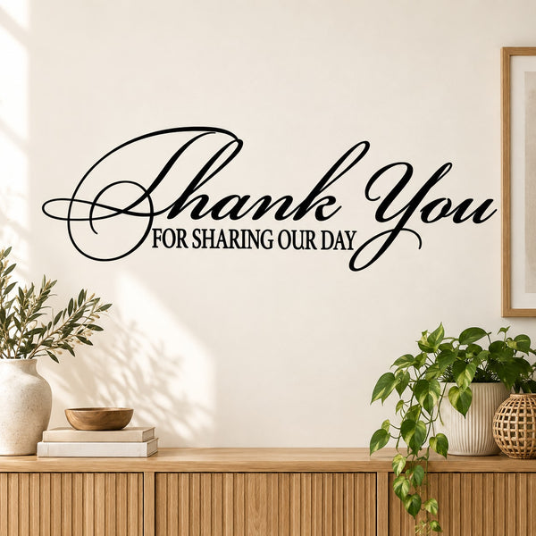 Wall decal reading “Thank You for Sharing Our Day” in black cursive script