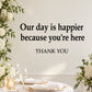 Wall decal text: 'Our day is happier because you're here' and 'THANK YOU'