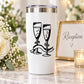 White tumbler with black decal of two champagne glasses toasting