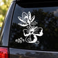 White floral wedding decal with leaves and swirl accents on a car window