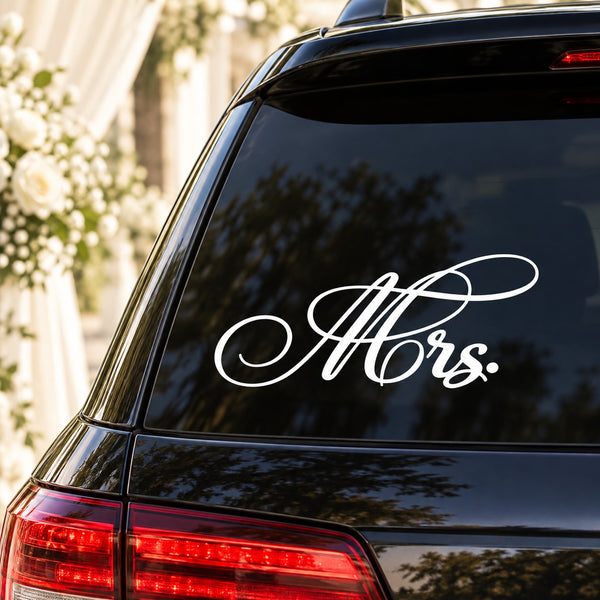 Wedding script car decal with white cursive 'Mrs.' on dark rear window