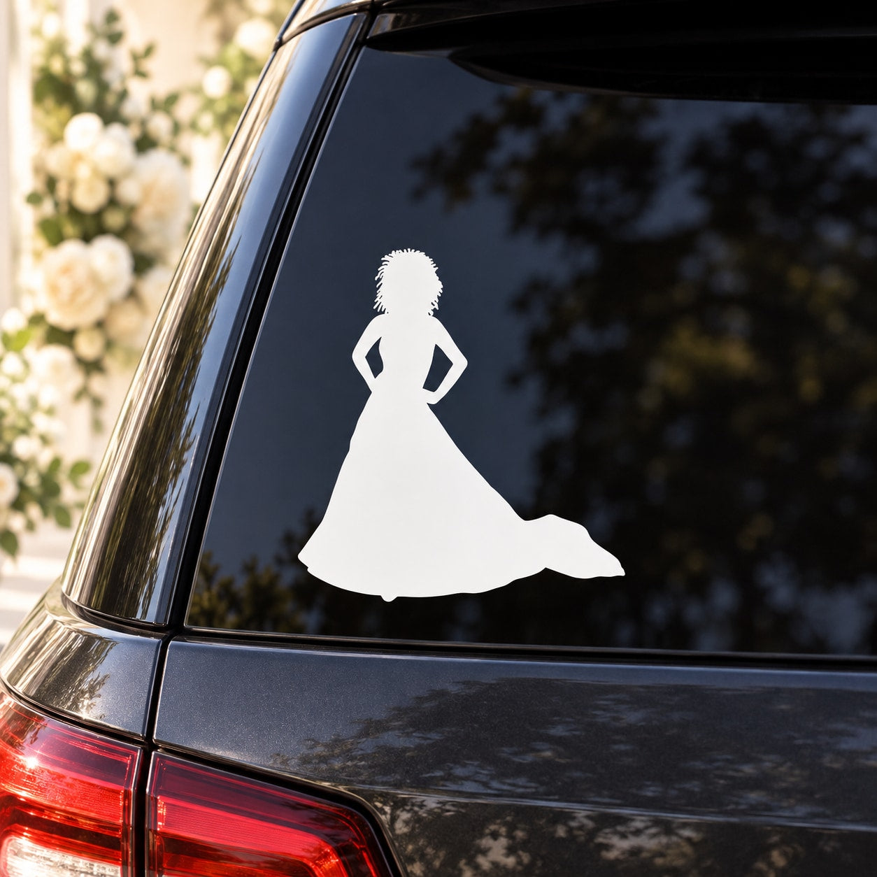 Bride silhouette window decal with white bridal dress figure on dark glass