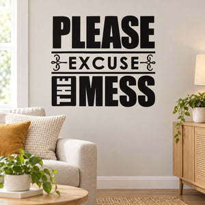 Wall decal with bold black text reading "Please Excuse the Mess"