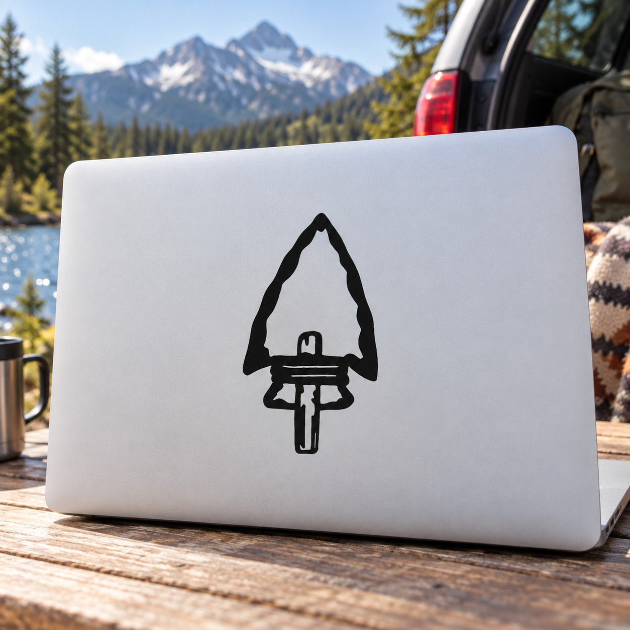 Arrowhead notched to a stick decal with black arrow symbol on white backing