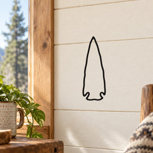 Arrowhead wall decal with thin black outline on light wall