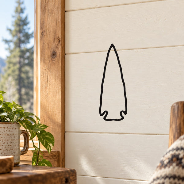Arrowhead wall decal with thin black outline on light wall