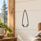 Arrowhead wall decal with thin black outline on light wall