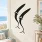 Abstract whale decal with two black stylized sperm whale silhouettes