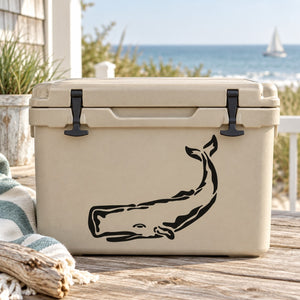 Sperm whale decal featuring black silhouette on a light-colored cooler