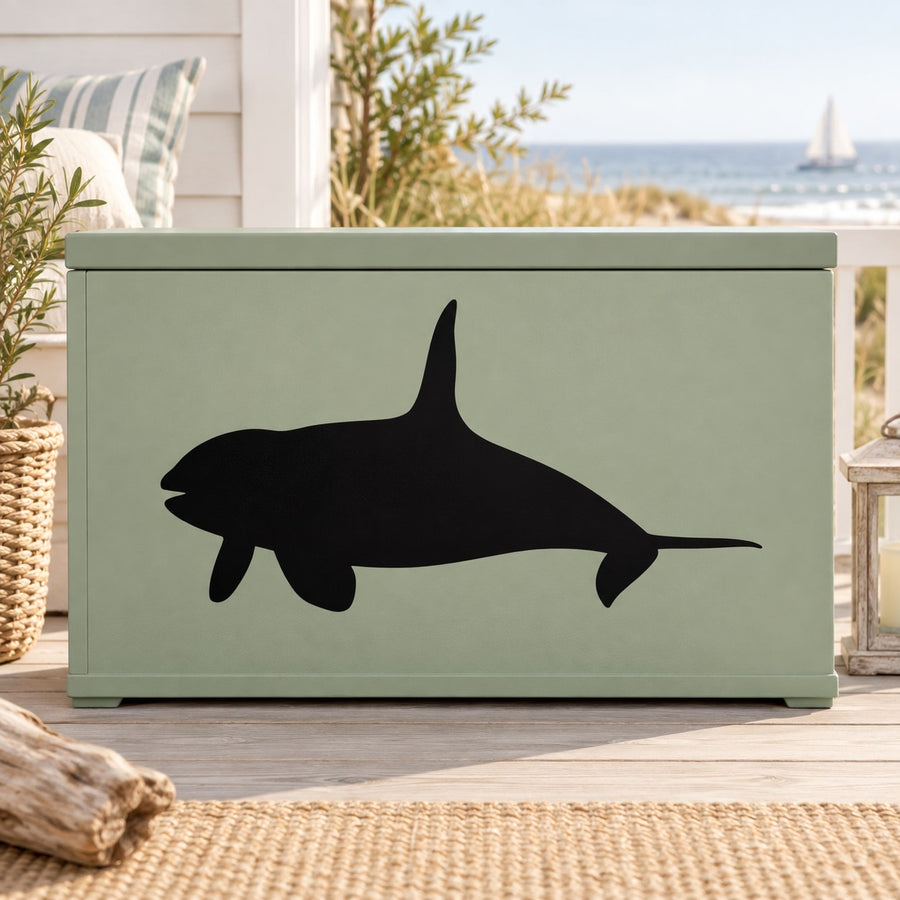 Beluga whale decal with black whale silhouette on light green rectangular backing