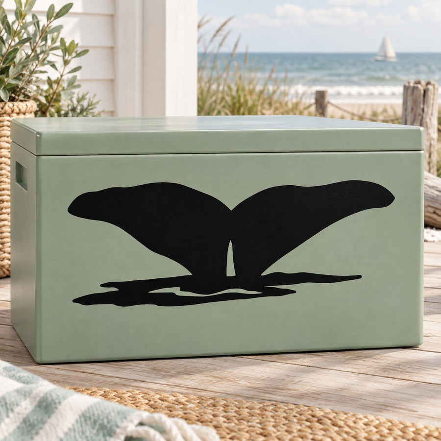 Black whale fin decal on a green rectangular surface
