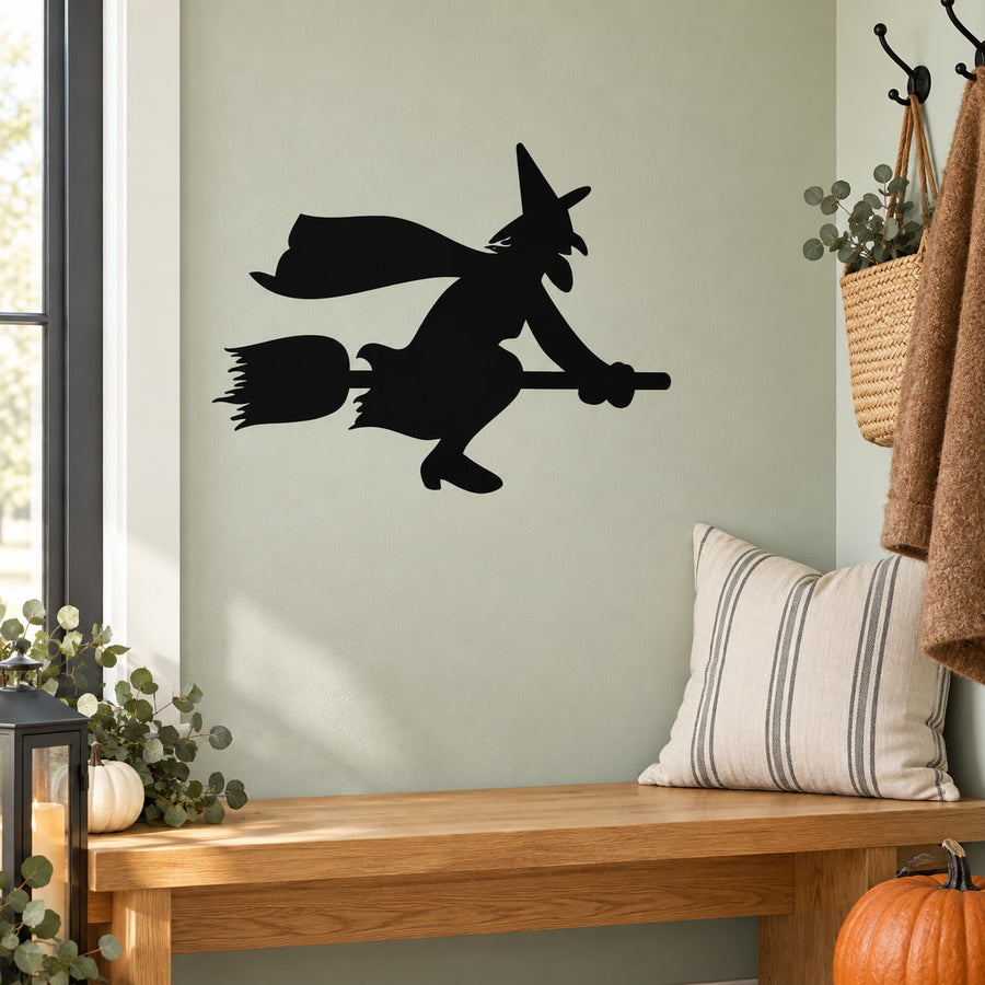 Witch riding a broom wall decal in black silhouette