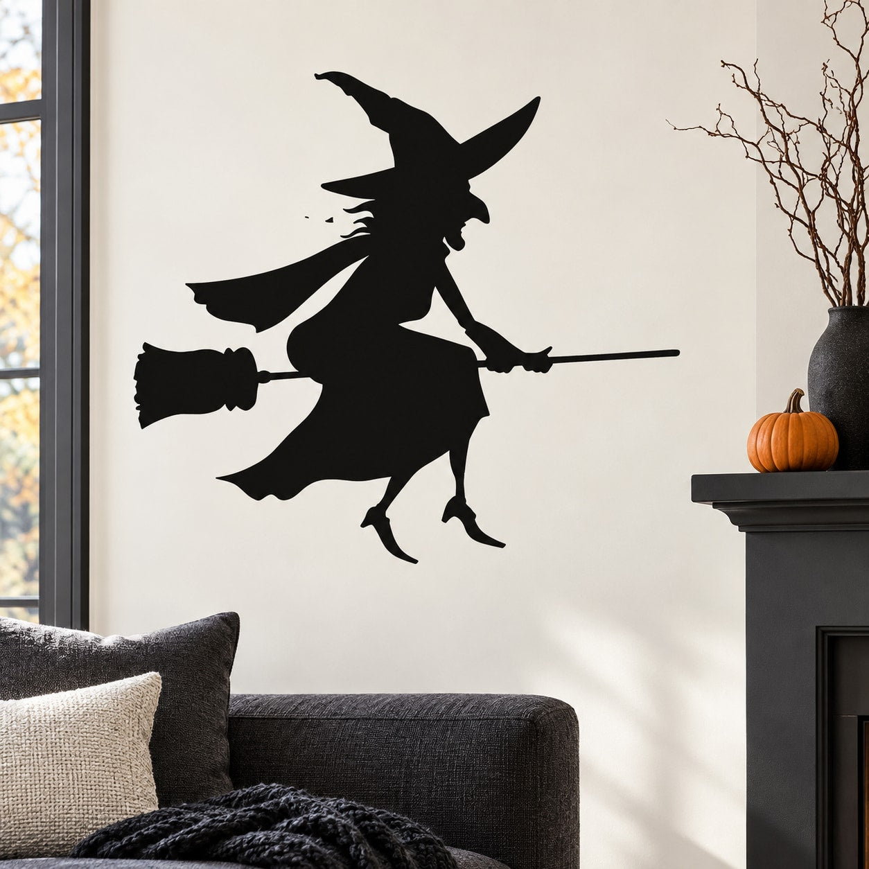 Black witch silhouette sitting on broomstick wall decal