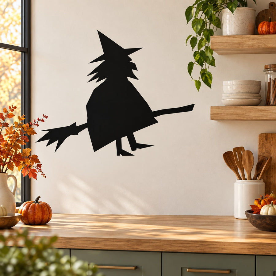 Black silhouette witch riding broom wall decal