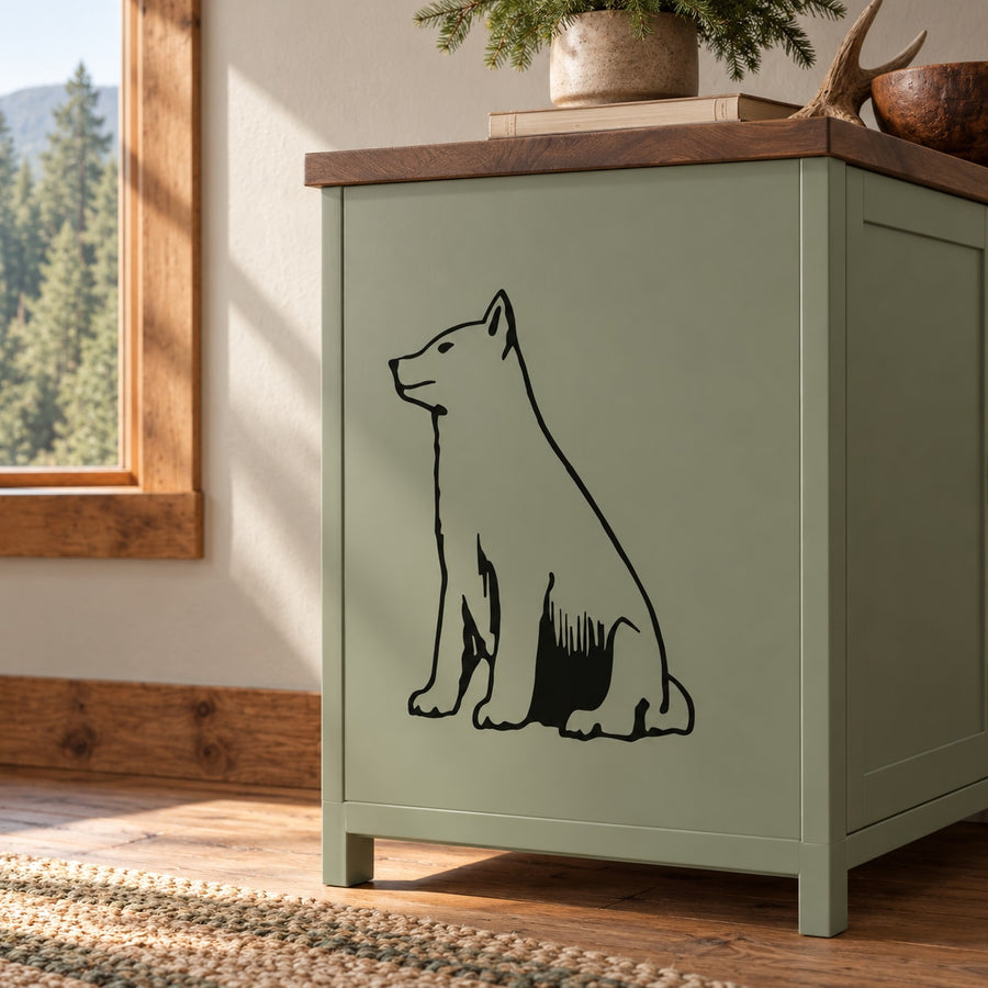 Sitting wolf wall decal with black outline on a cabinet door