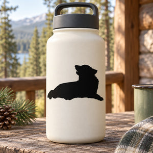 Black silhouette reclining wolf decal on white water bottle