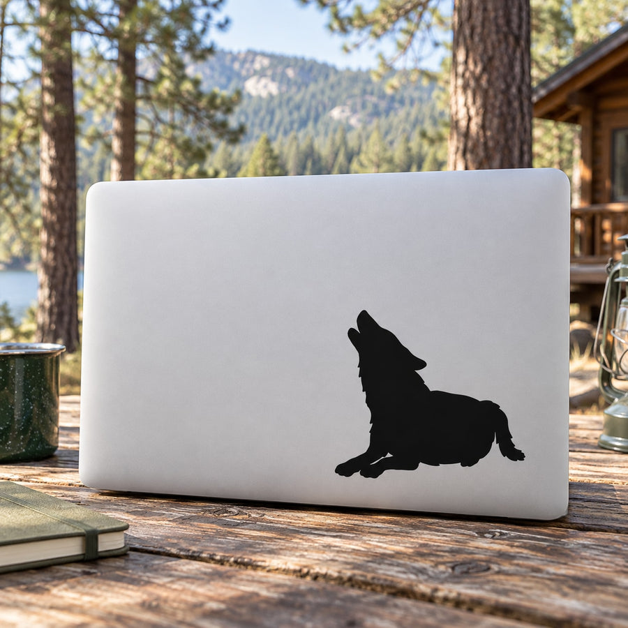 Wolf howling decal sticker on laptop, black silhouette on white