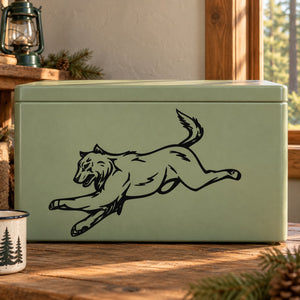 Attacking wolf decal graphic in black line art on a light green surface