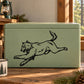Attacking wolf decal graphic in black line art on a light green surface