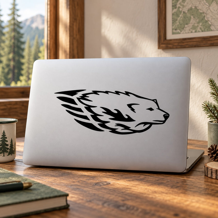 Black wolf head decal on light gray laptop lid