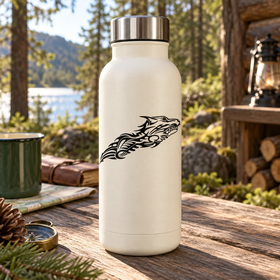 Cream insulated water bottle with black tribal wolf decal on the front