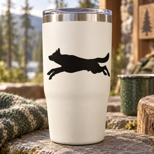 Leaping wolf decal: black silhouette of a running wolf on a light background