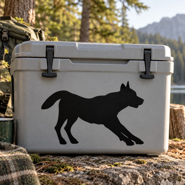 Black stretching wolf silhouette decal, full-body side profile