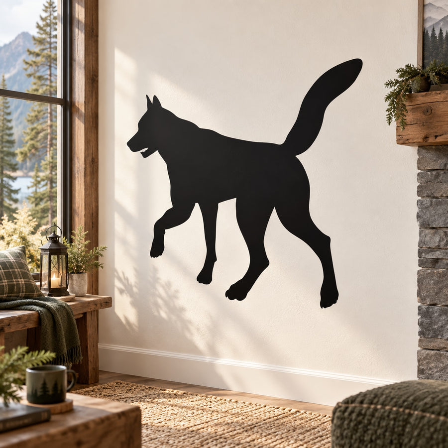 Wolf silhouette decal with raised paw, black outline on a wall