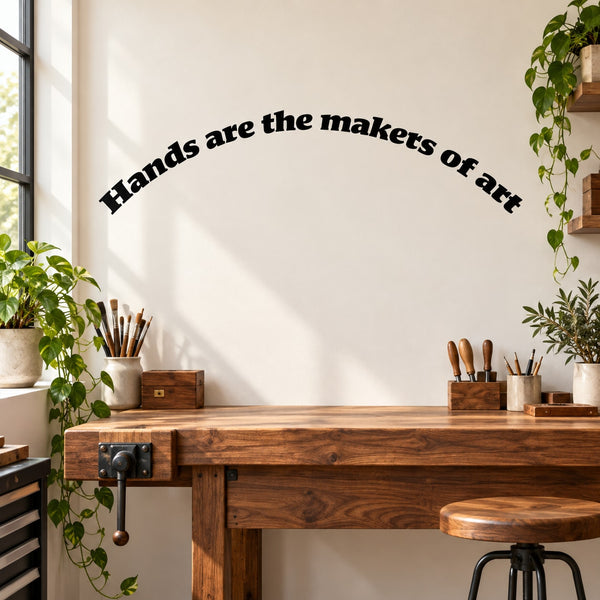 Wall quote decal with curved text: “Hands are the makers of art”
