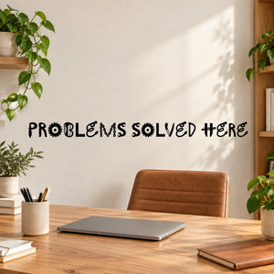 Wall quote decal: 'PROBLEMS SOLVED HERE' in colorful lettering