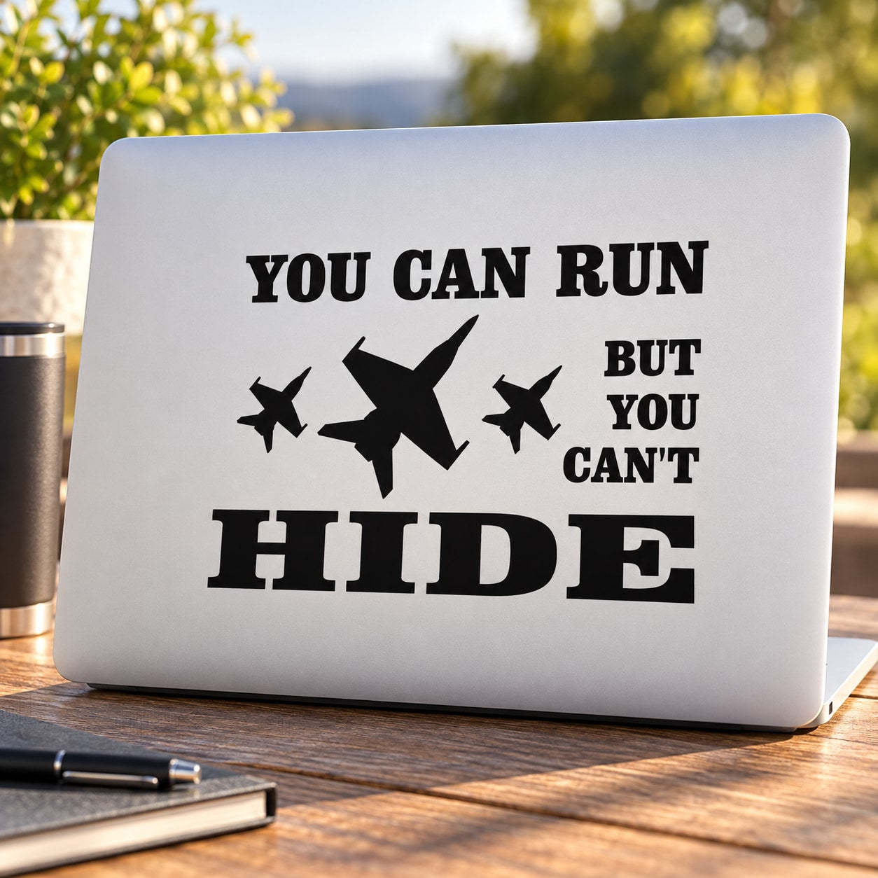 White jet decal with bold text “YOU CAN RUN” and plane silhouettes