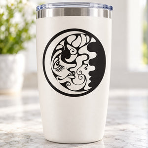 White tumbler with black moon-face decal in a circular design