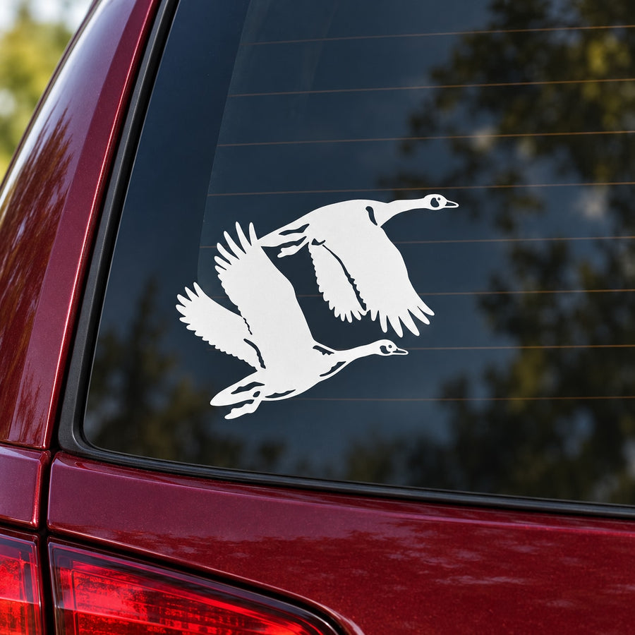 Two geese flying decal, white bird design on car window