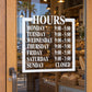 Square business hours decal with days and opening/closing times on dark background