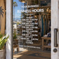 Business hours window decal with centered white text listing weekly hours and closed