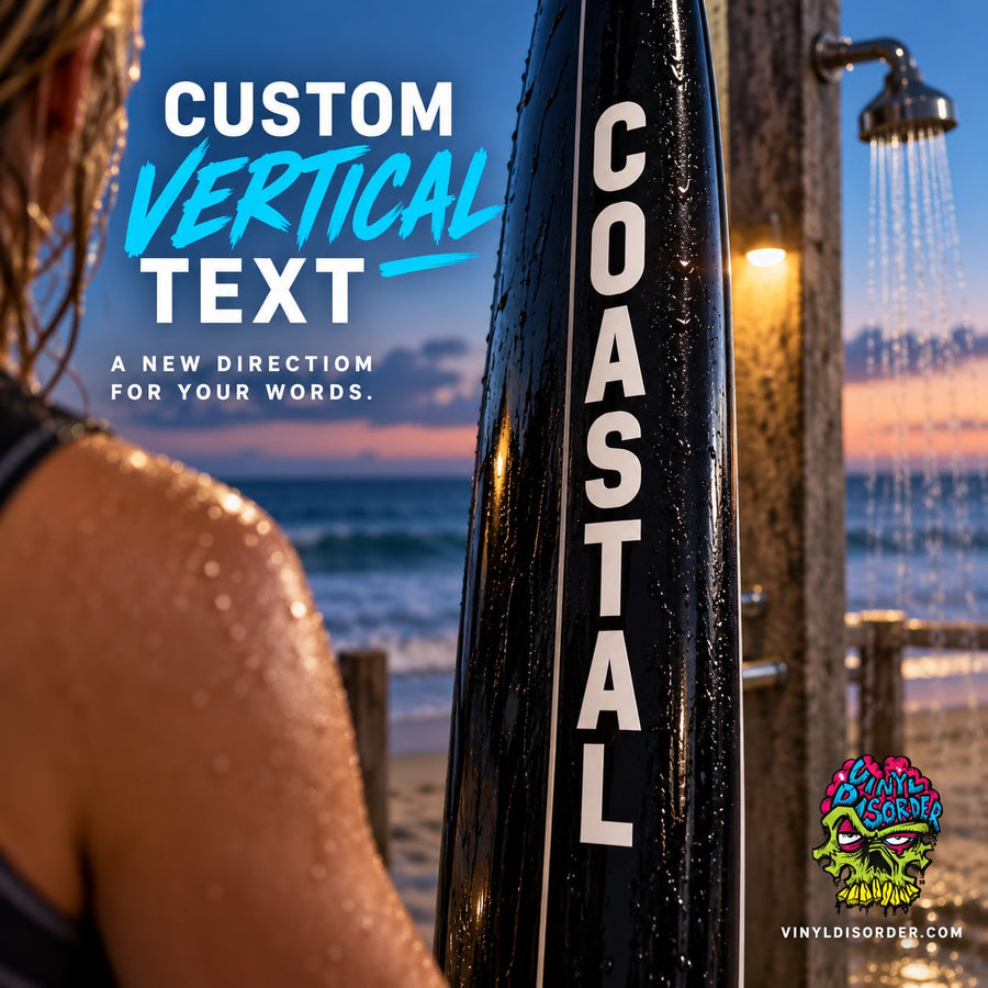 Black vertical text decal with white letters reading COASTAL on a post.