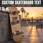 Skateboard with dark "STAY ROLLING" vinyl text decal on wooden deck