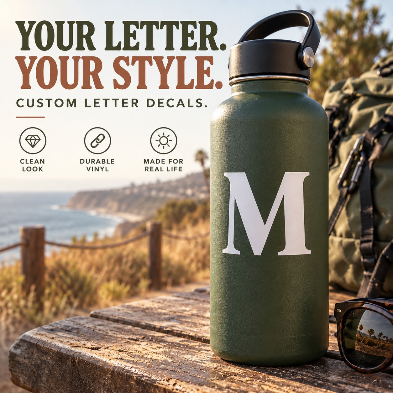 Capital letter “M” vinyl decal applied to a dark green water bottle