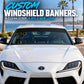 Windshield banner decal kit with clear strip across a car windshield
