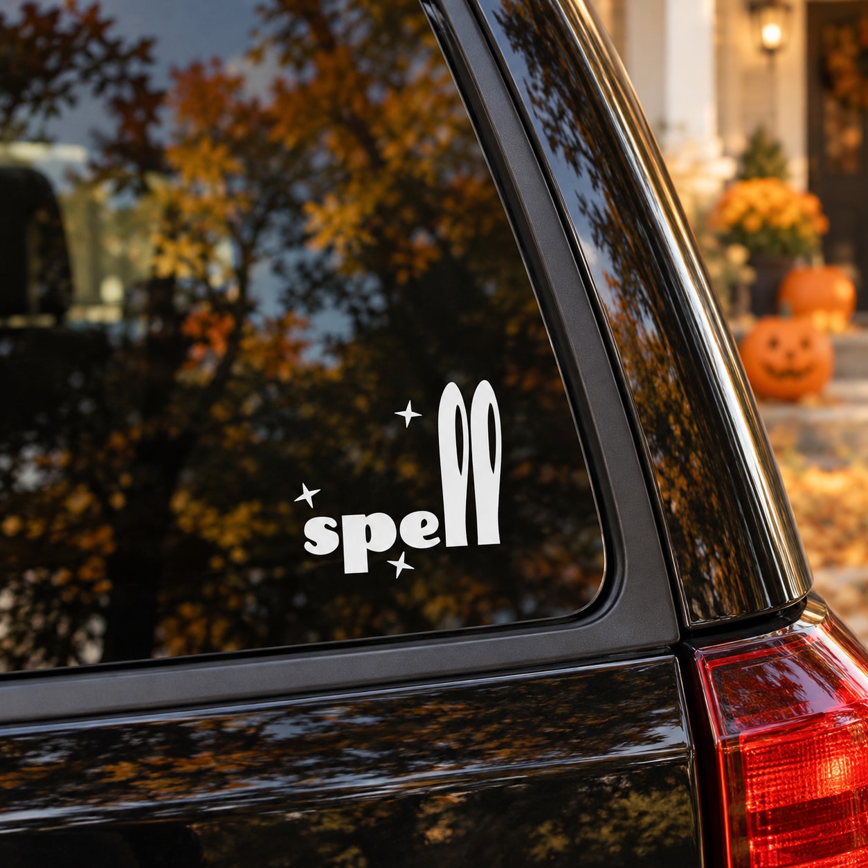 Halloween spell vinyl decal with stars and oval icons on car window