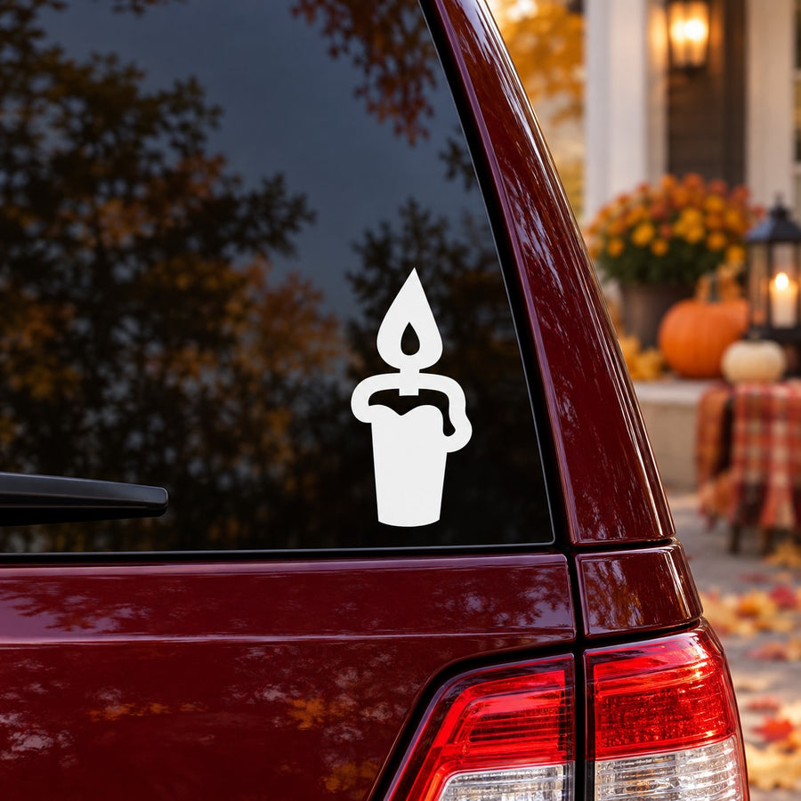 Halloween lit candle decal icon, white silhouette on dark car window