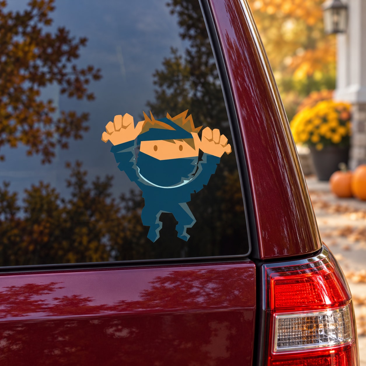 Cartoon mummy costume character sticker on car window, blue hood and face