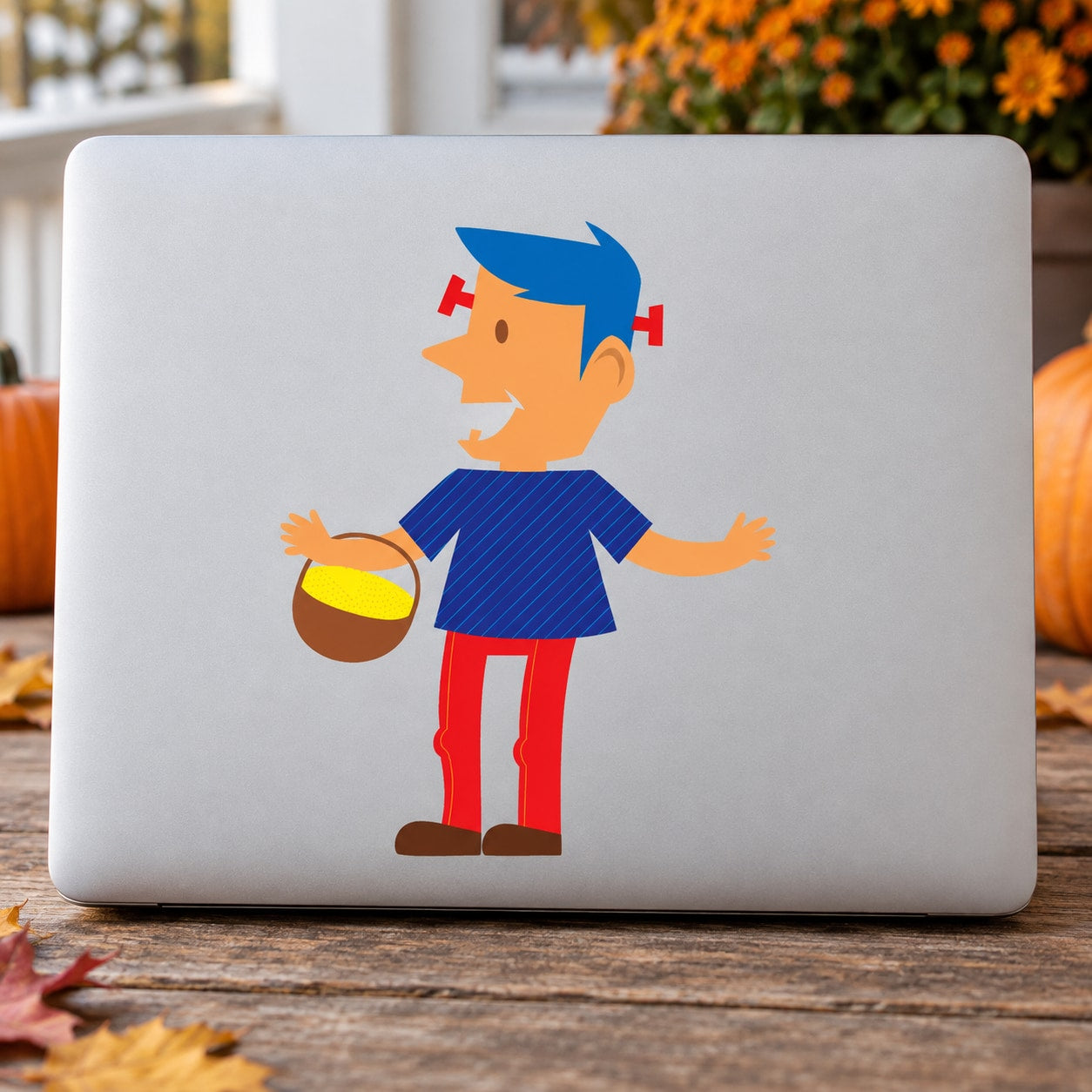 Halloween monster character decal on a light surface: boy with blue hair holding candy bucket