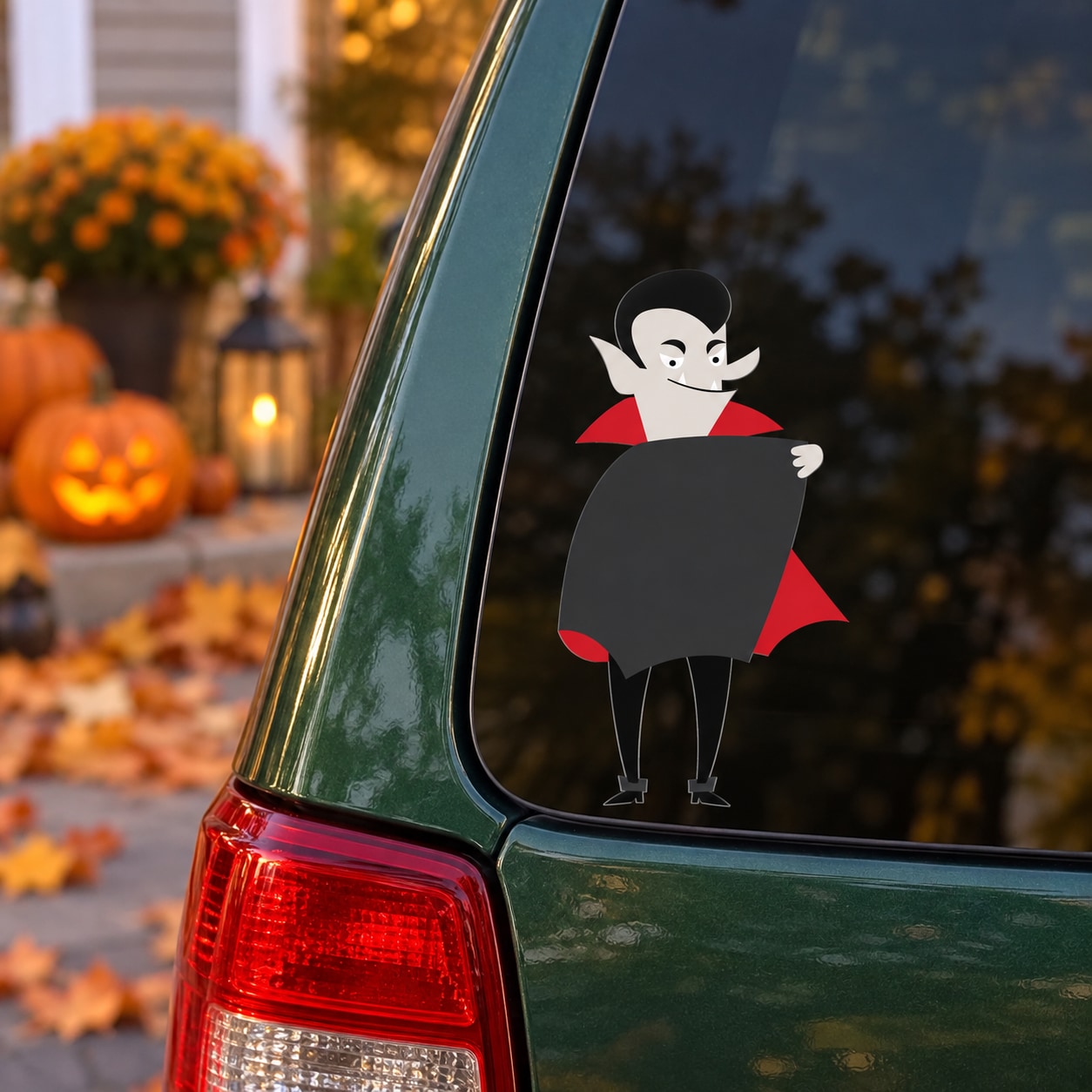 Halloween Dracula character decal on window glass, black cape with red shoulders and legs