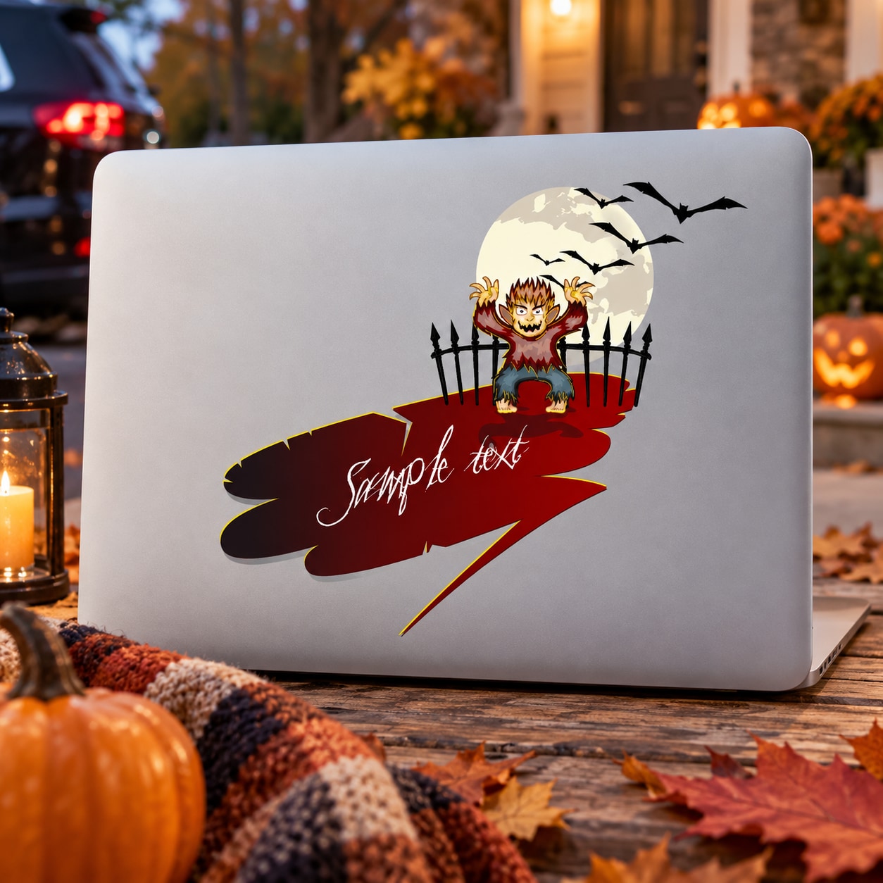 Halloween werewolf laptop decal with full moon, bats, and fence silhouette