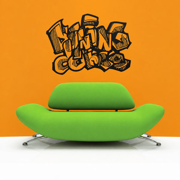 Graffiti vinyl wall decal with black tag-style lettering and icons