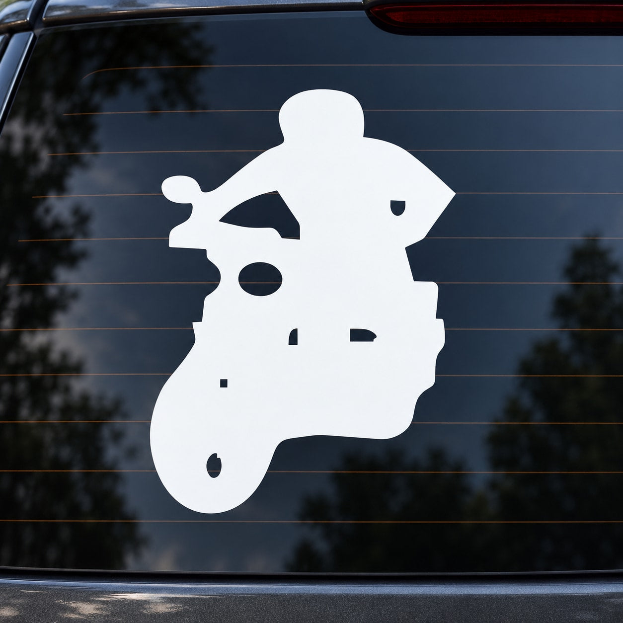 White scooter rider decal silhouette on a car window