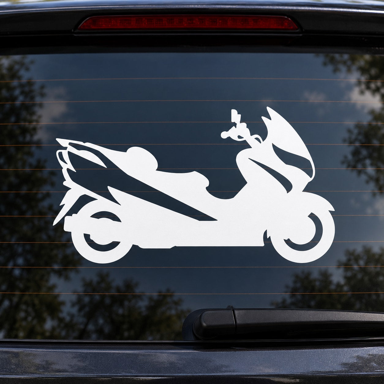 White scooter decal featuring racing scooter silhouette on car window